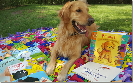 Golden retriever on blanket with books